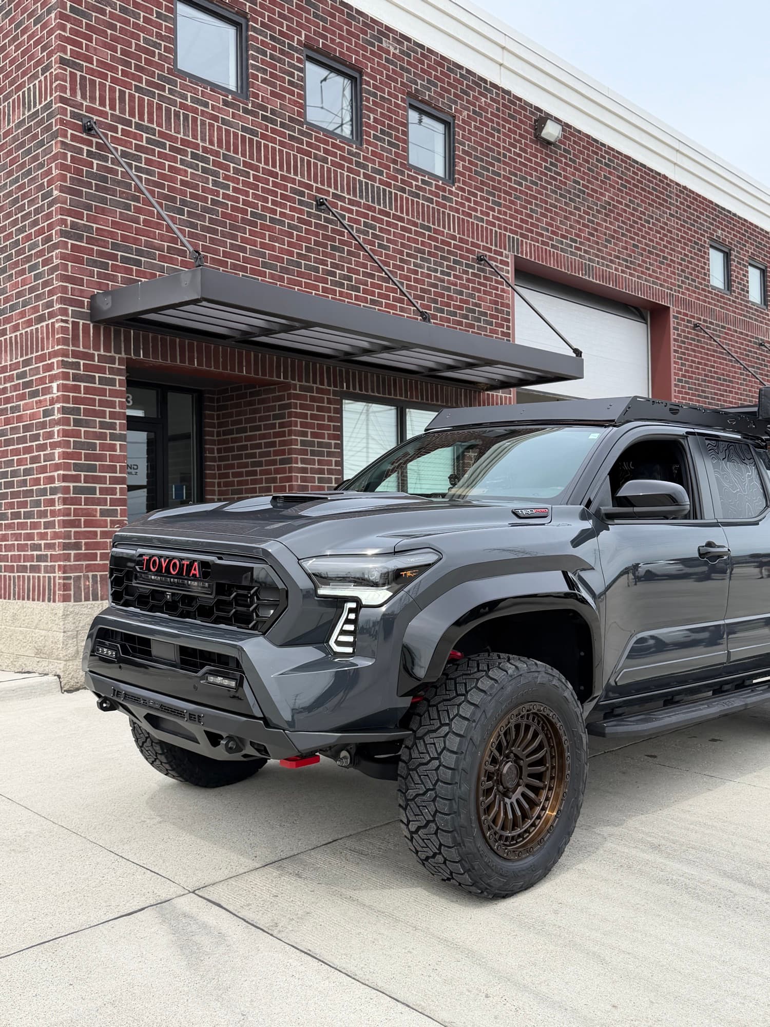 Gray Toyota Tacoma TRD Pro parked in front of the Diamond Detailz building